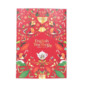 Calendário do advento em formato de livro da marca English Tea Shop, com 24 saquetas de chá e infusões biológicas, cada uma com sabor diferente, em embalagem vermelha decorada com motivos festivos.