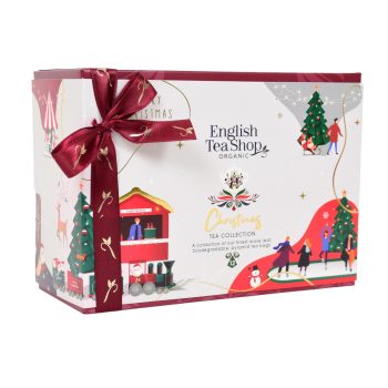 Caixa de chás e infusões biológicos English Tea Shop, coleção de Natal com 12 pirâmides de 6 sabores diferentes, embalagem decorativa branca com ilustrações natalícias e laço vermelho.