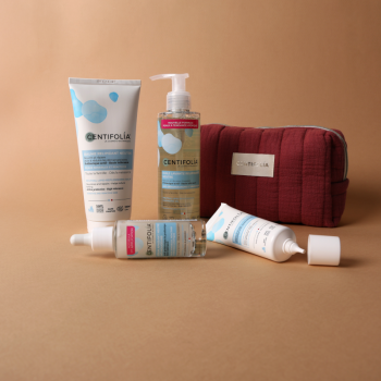 Coffret Neutra da Centifolia com bolsa vermelha e quatro produtos para peles sensíveis: sérum 30ml, creme de rosto 40ml, óleo de lavagem 195ml e bálsamo nutritivo 200ml, com prébioticos ativos, sobre fundo bege.